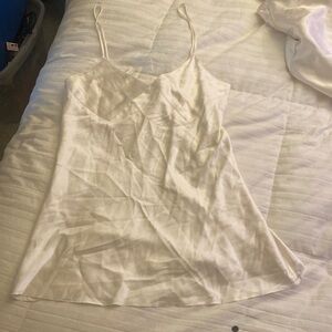 Hand made off White women’s thin short Slip. A pair of jeans and a nice blouse.